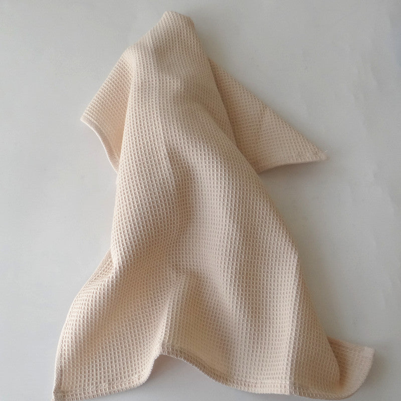 Cream cotton waffle weave kitchen tea towel, draped